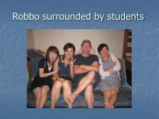 Robbo surrounded by students